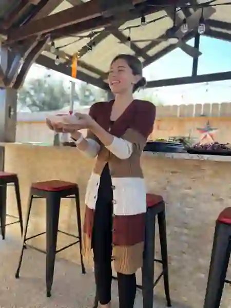Birthday guest with sparkler dessert near the covered gathering area